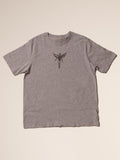 Gray t-shirt with a small graphic on a beige background