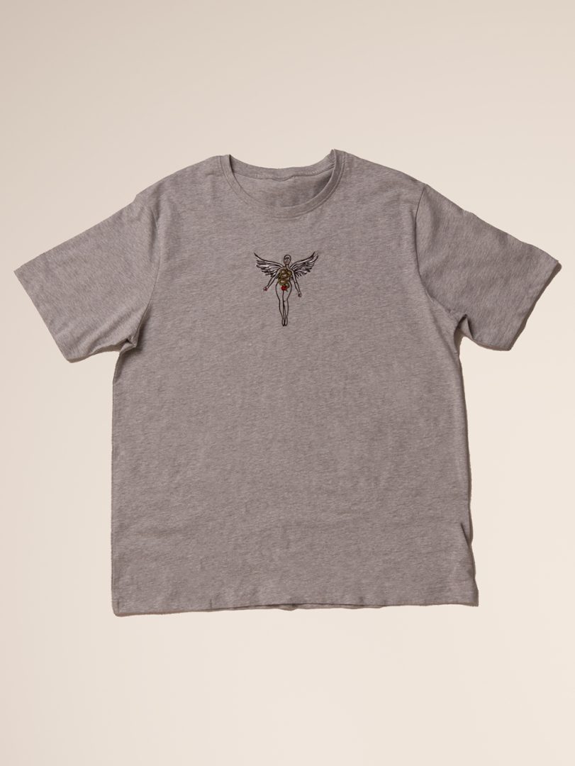Gray t-shirt with a small graphic on a beige background