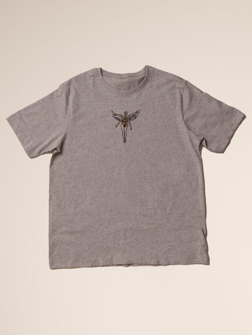 Gray t-shirt with a small graphic on a beige background