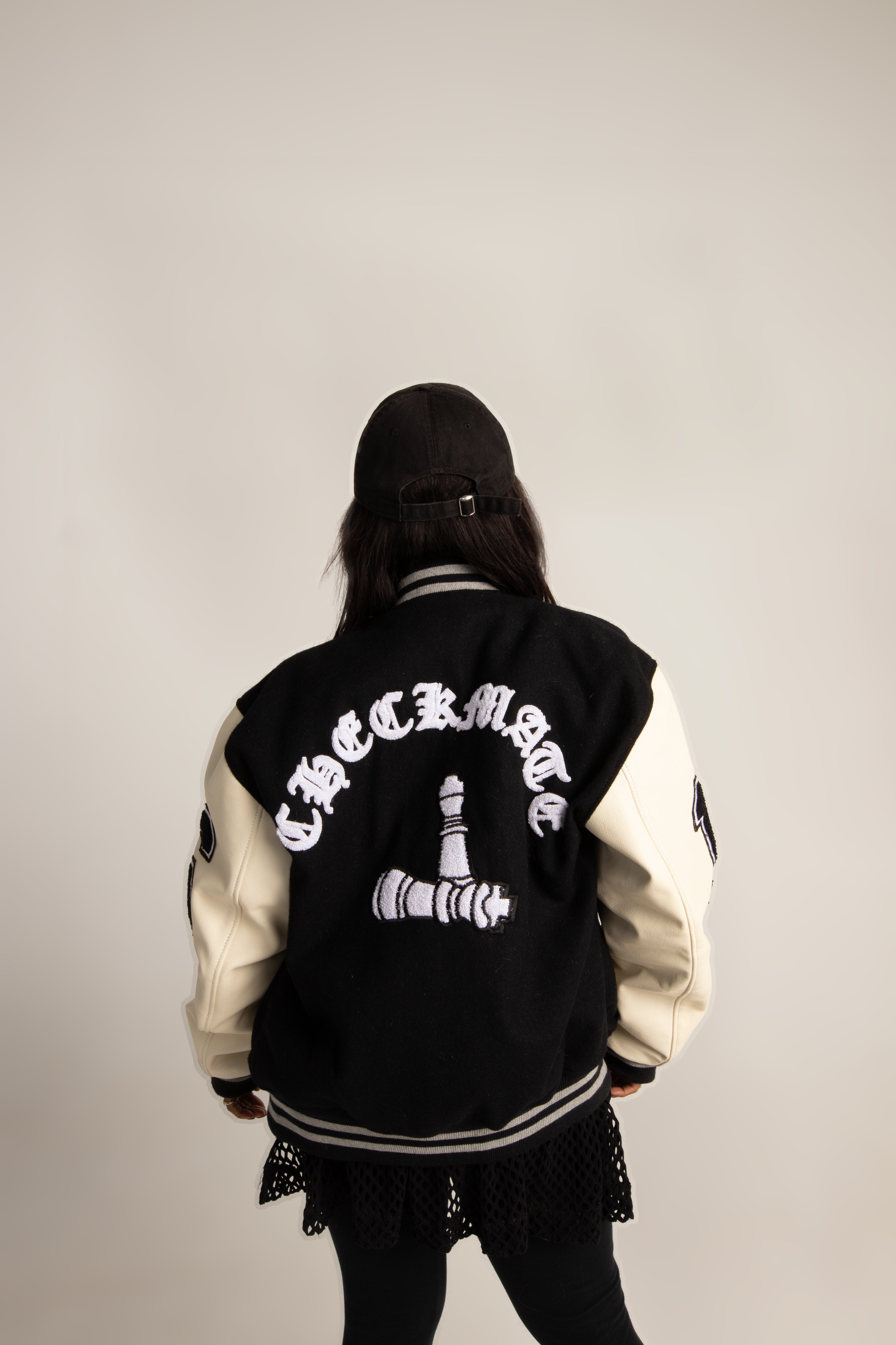 CheckmatexDelvon Jae Varsity Jacket in Black & White