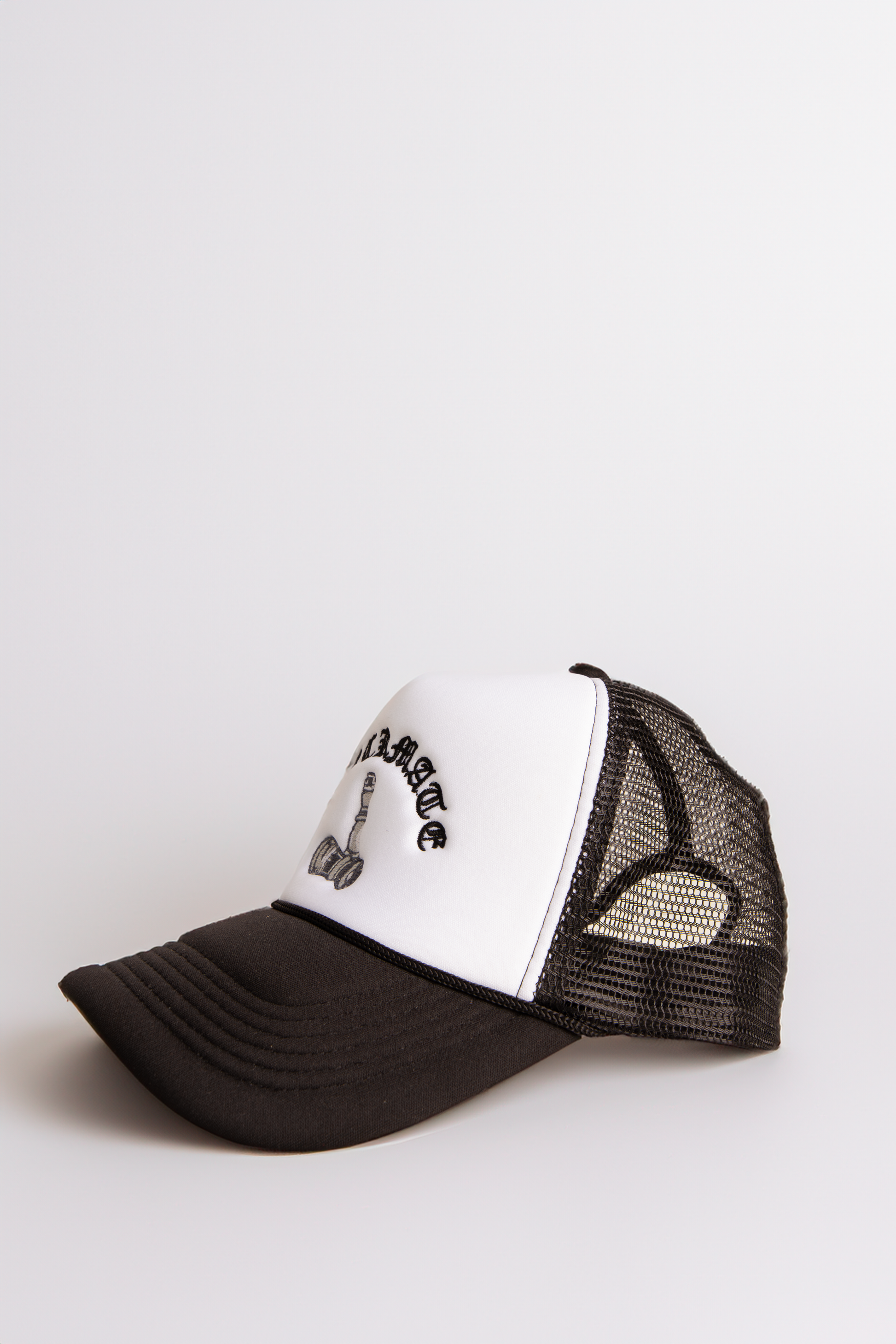 Checkmate Anywear Trucker in Black & White Embroidery - OS