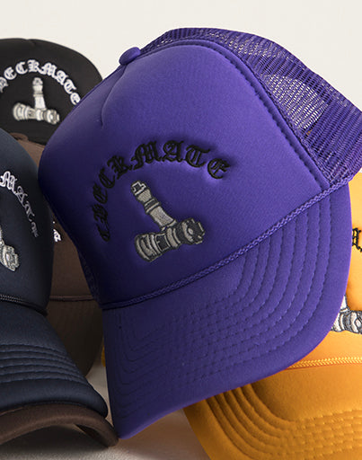 Checkmate Anywear purple trucker with embroidered design on a white background