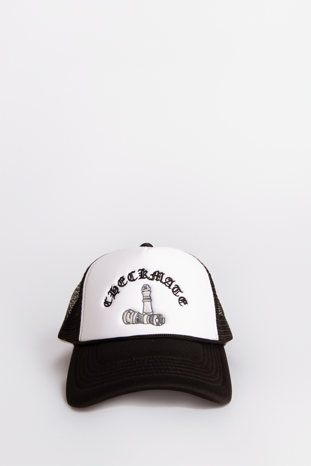 Black and white cap with text on a light neutral background