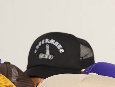 Black checkmate anywear trucker hat with white text on a gray background