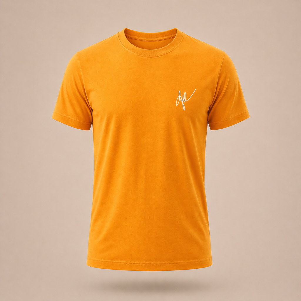 Yellow-orange t-shirt with a small white signature logo on a beige background