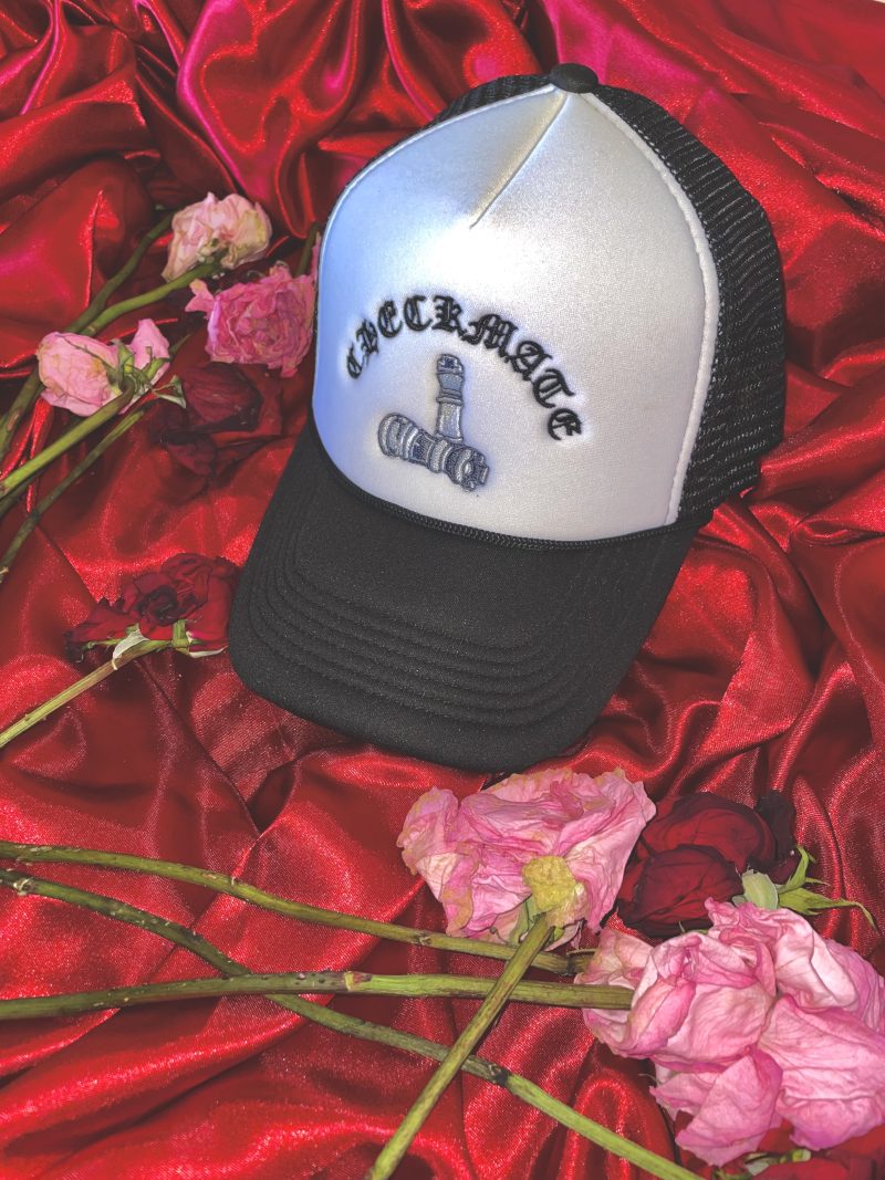 Checkmate Anywear Trucker Black and White with Black Embroidery on flowers, and satin background